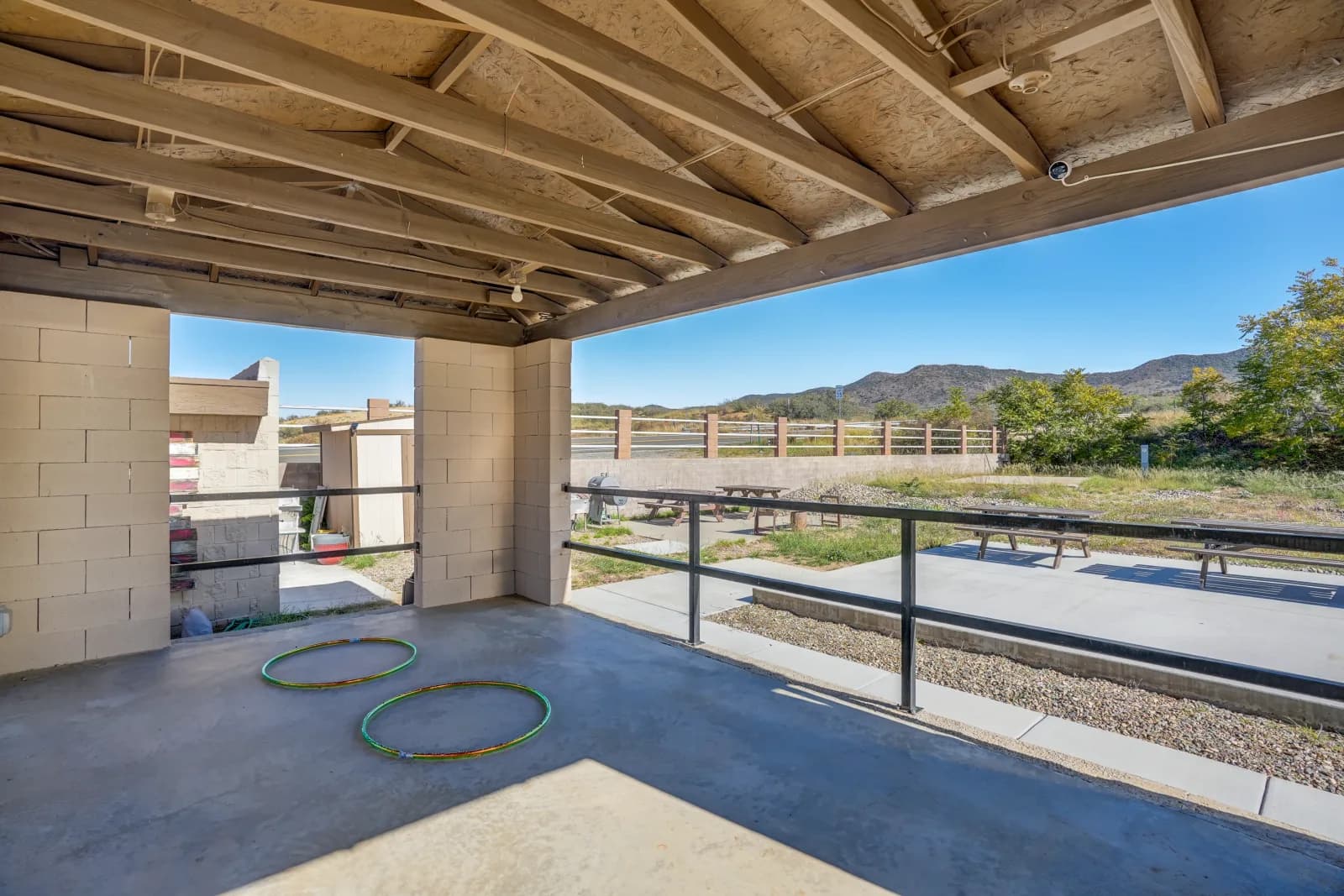 Covered patio overlooking the RV park and desert hills
