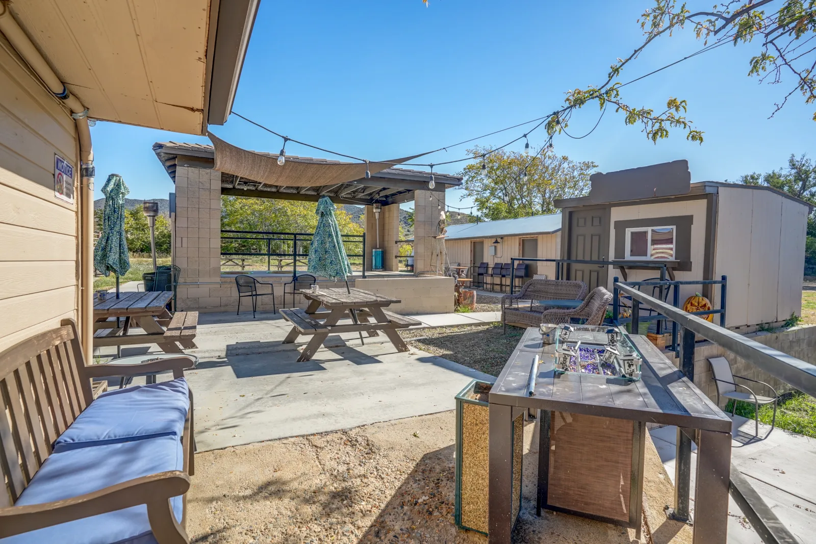 The back patio at Burro RV Park, shaded seating looking out over the Kirkland high desert